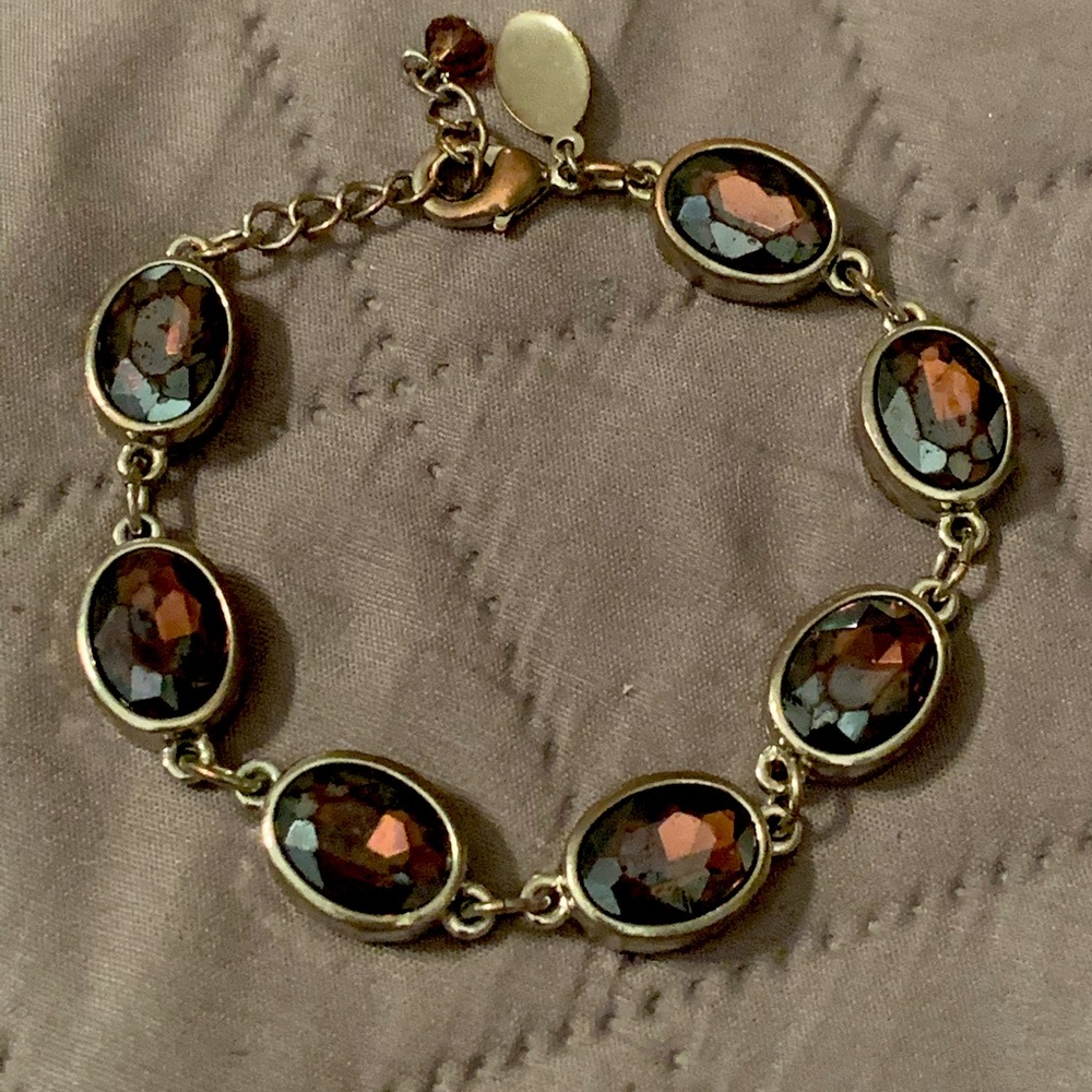 White House Black Market silver with deep red stones bracelet.